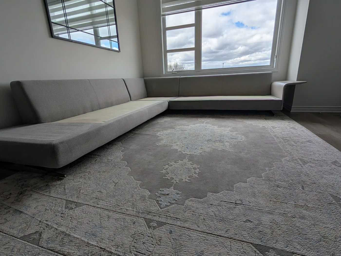 Grey sectional with seat cushions removed