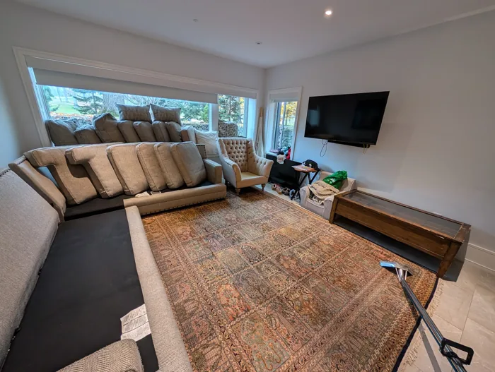 Patterned rug and upholstered seating during a cleaning visit