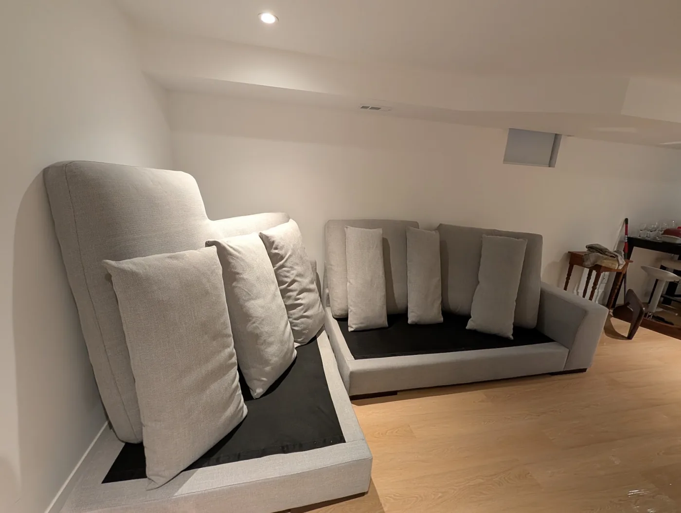 Grey sofa sections and upright cushions