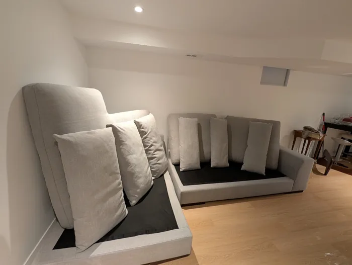 Sectional sofa with cushions standing upright